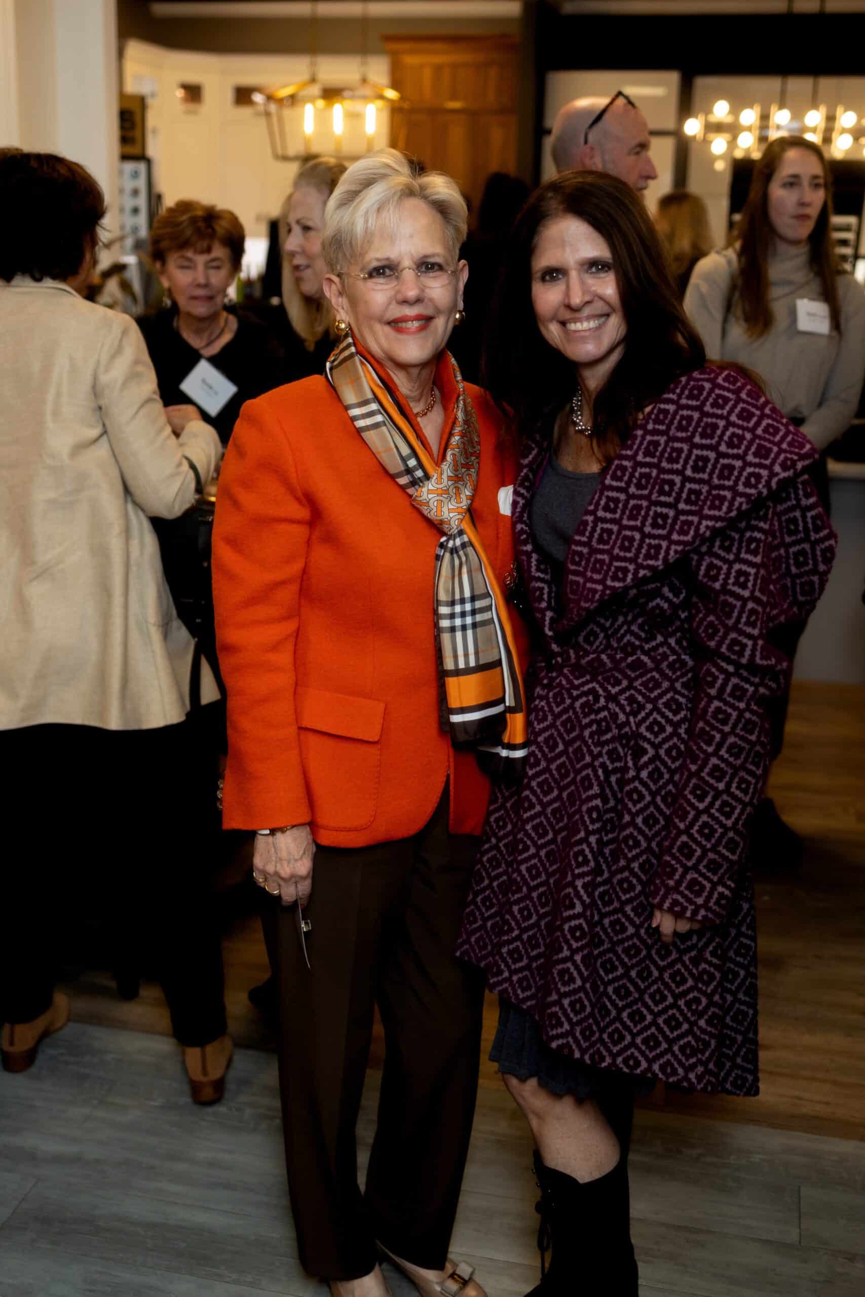 USA Cabinet Store Home And Design Event - Joyful moment with two women smiling